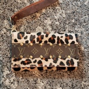 Cowhide wristlet with Louis Vuitton accent